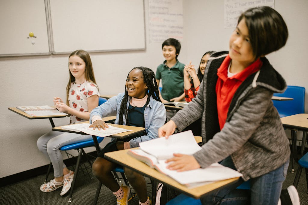 A group of diverse students actively participating in a classroom setting, promoting inclusivity and learning.